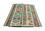 Sangat Ulbolsyn Turquoise/Ivory Rug, 5'9" x 8'1"