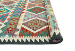 Sangat Ulbolsyn Turquoise/Ivory Rug, 5'9" x 8'1"